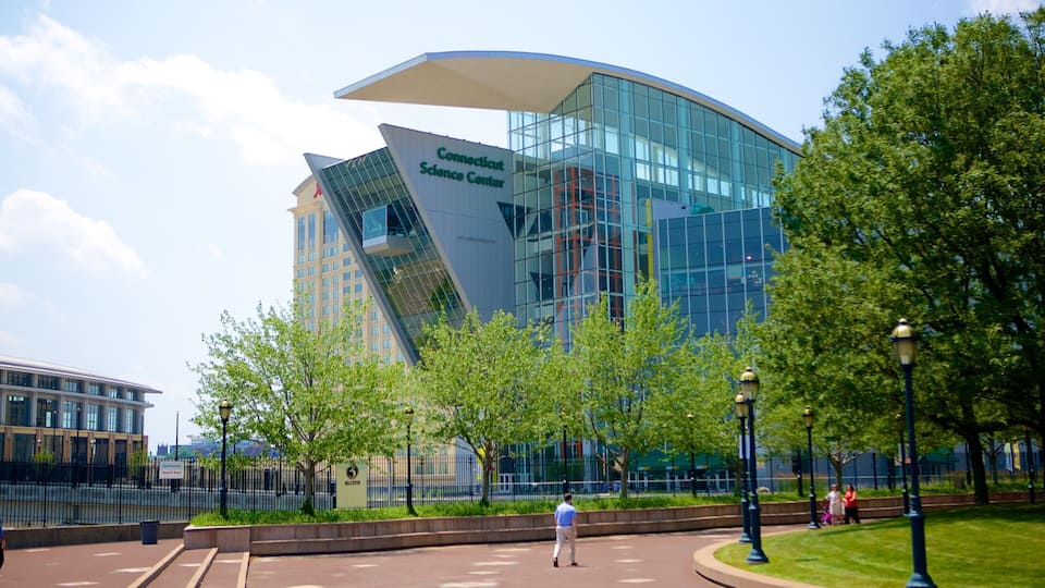 The Connecticut Science Center with a modern glass building and surrounding greenery.