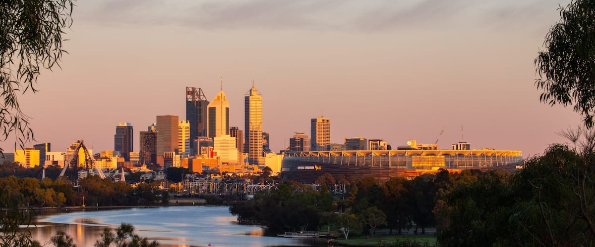 Perth showing a city, a sunset and a river or creek