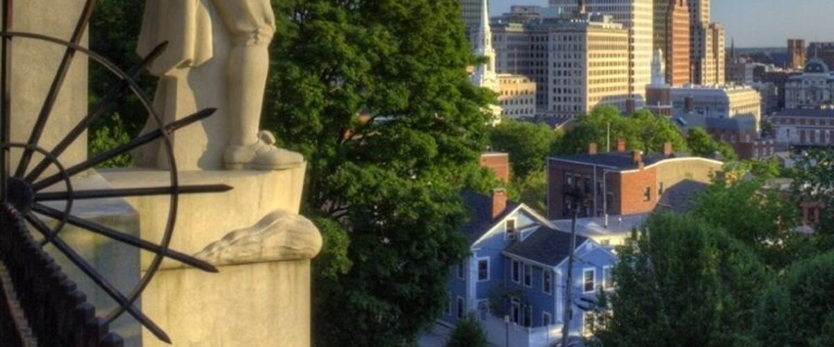 An iconic view of Roger Williams' statue overlooking the city that man founded, Providence