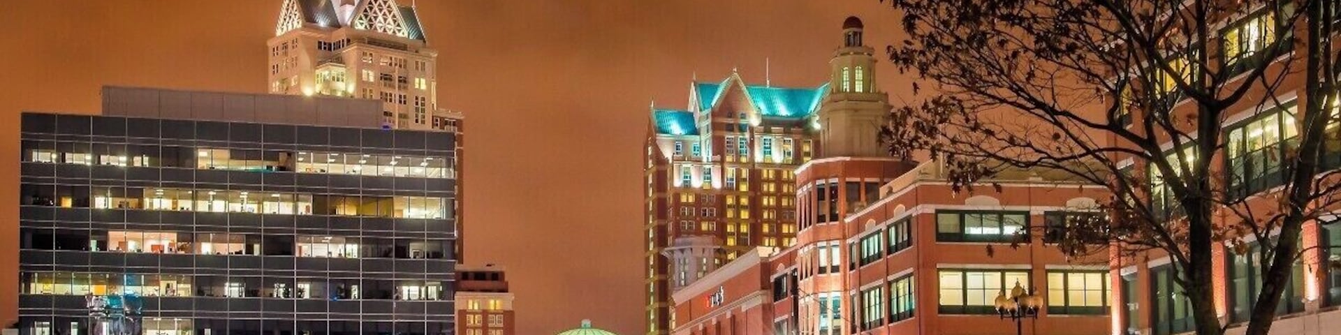 It's a Friday night, leaving the office on way to my car, I came across this view of downtown Providence.
I really like the drama in the sky, dark ominous, foreboding. And it stands in such stark contrast to the bright, well lit buildings.