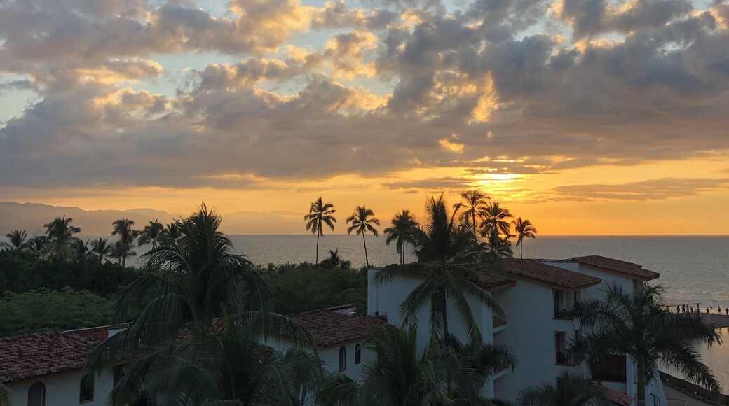 Watching the sun rise from my hotel balcony.