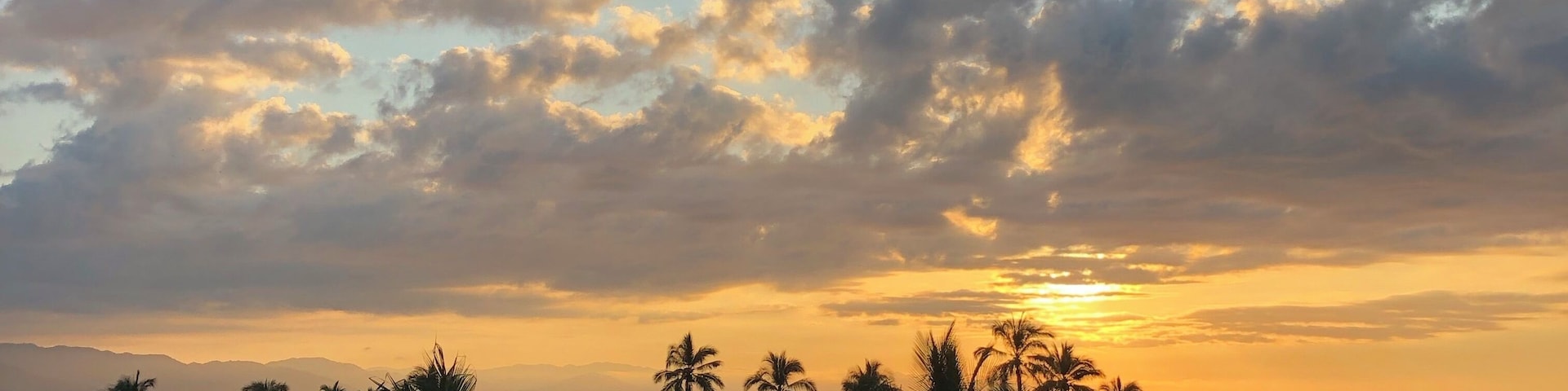 Watching the sun rise from my hotel balcony.