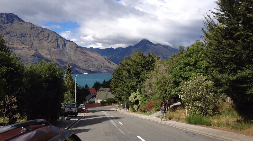 Fernhill Road neighbourhood in Queenstown, New Zealand. The scenic beauty of Lake Wakatipu and the Remarkables mountains is truly awesome. Was walking down this road looking for the corner shop, and was struck by this view, most unforgettable.