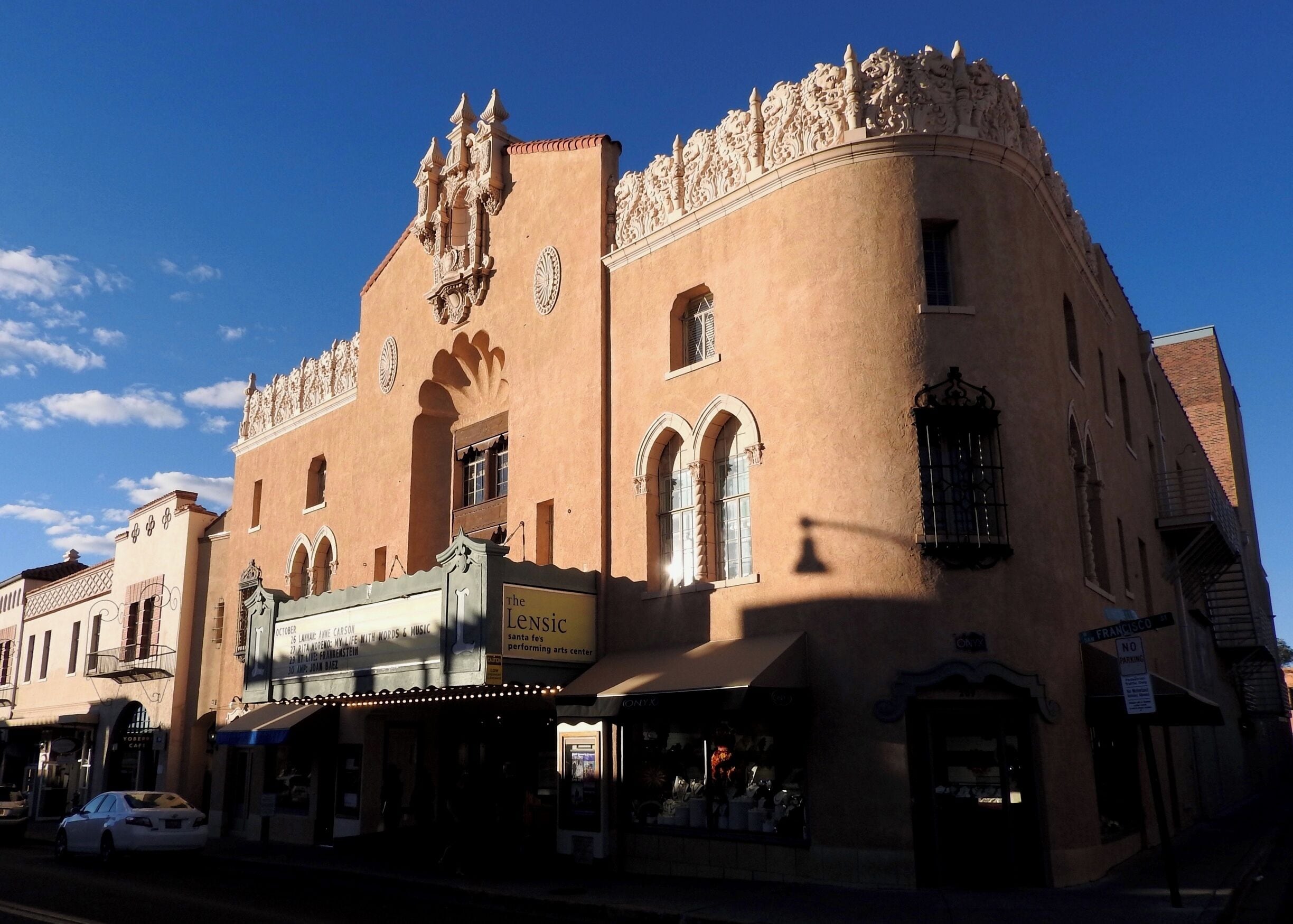 The Lensic Theater, located at 211 West San Francisco Street in Santa Fe, New Mexico, is an 821-seat theater designed by Boller Brothers of Kansas City, well-known movie-theater and vaudeville-house architects who designed almost one hundred theaters throughout the West and mid-West, including the KiMo Theater in Albuquerque. The pseudo-Moorish, Spanish Renaissance Lensic was built by Nathan Salmon and E. John Greer and opened on 24 June 1931. Its name derives from the initials of Greer's six grandchildren.
The Lensic was completely restored and renovated between 1999 and 2001, and provides Santa Fe and Northern New Mexico with a modern venue for the performing arts.