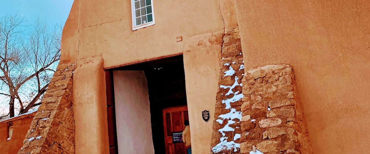 San Miguel Mission is a Spanish colonial mission church in Santa Fe, New Mexico. Built between approximately 1610 and 1626, it is the oldest known church in the United States. The church was damaged during the Pueblo Revolt of 1680 but was rebuilt in 1710 following the Spanish reconquest and served for a time as a chapel for the Spanish soldiers.