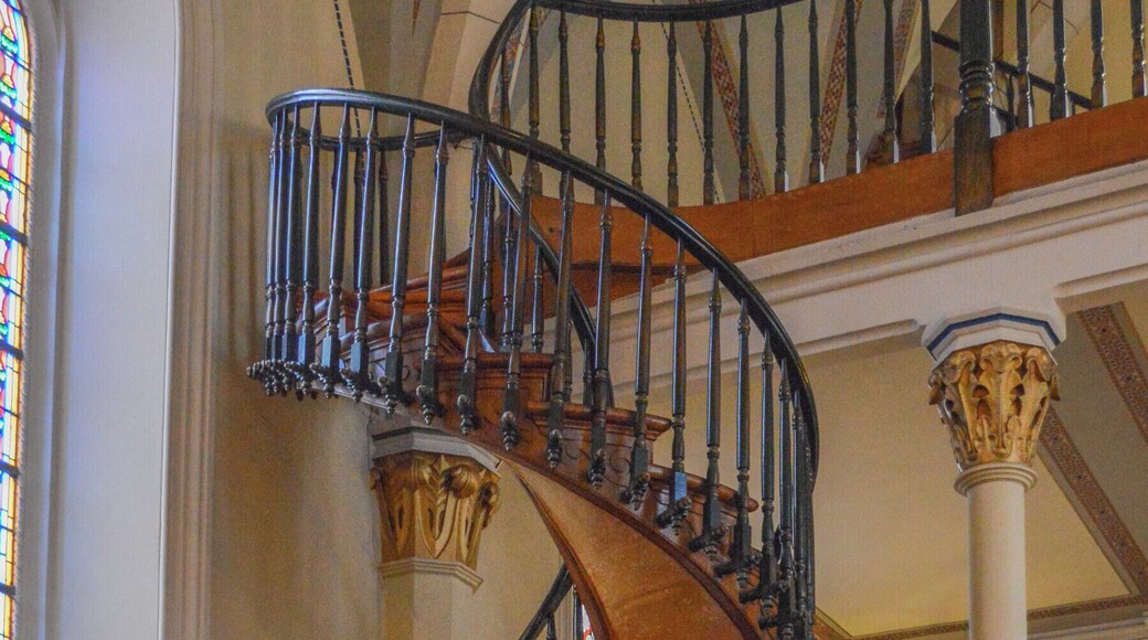 The famous and beautiful staircase in the Loretto Chapel in Santa Fe, NM. When the chapel was completed in 1878, there was no way to access the choir loft. It was suggested that a ladder be used, but the nuns who used the chapel didn't like this idea because of the long habits that they wore. So they prayed to St Joseph for a solution. Shorty thereafter a carpenter showed up and offered to build the staircase for them, but he needed total privacy to do so and locked himself in the chapel for 3 months. When he was done he left town, without even accepting payment. The staircase he built is not only beautiful, but it is an architectural wonder. It makes two complete 360 turns, there are not metal nails, and there is no center means of support. The identity of the carpenter was never known. #newmexico #santafe #lorettochapel #church #stairs #architecture