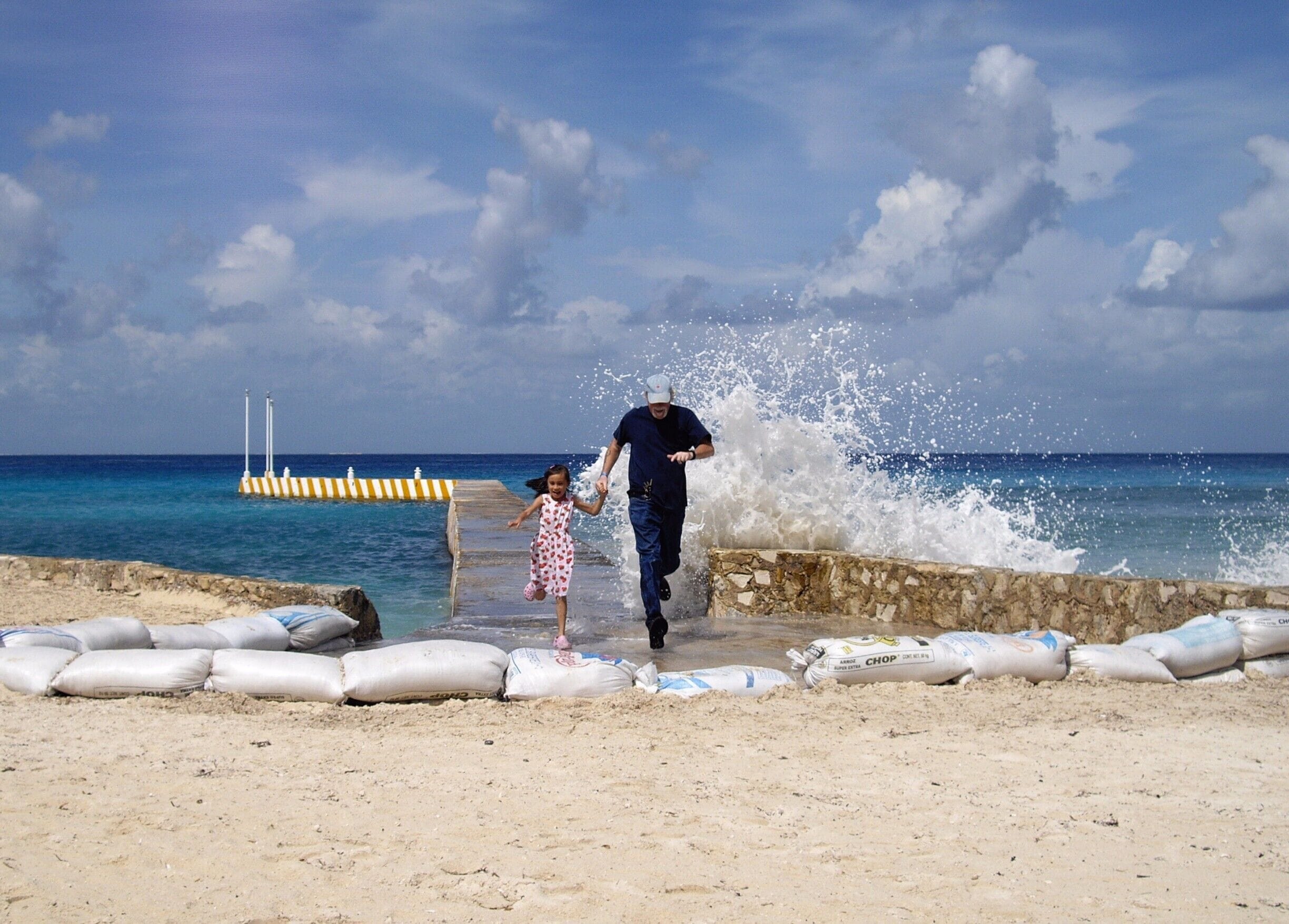 Trying to beat the waves in Cozumel, Mexico.