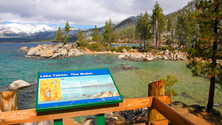 A clear view of Lake Tahoe with a signboard in the foreground.