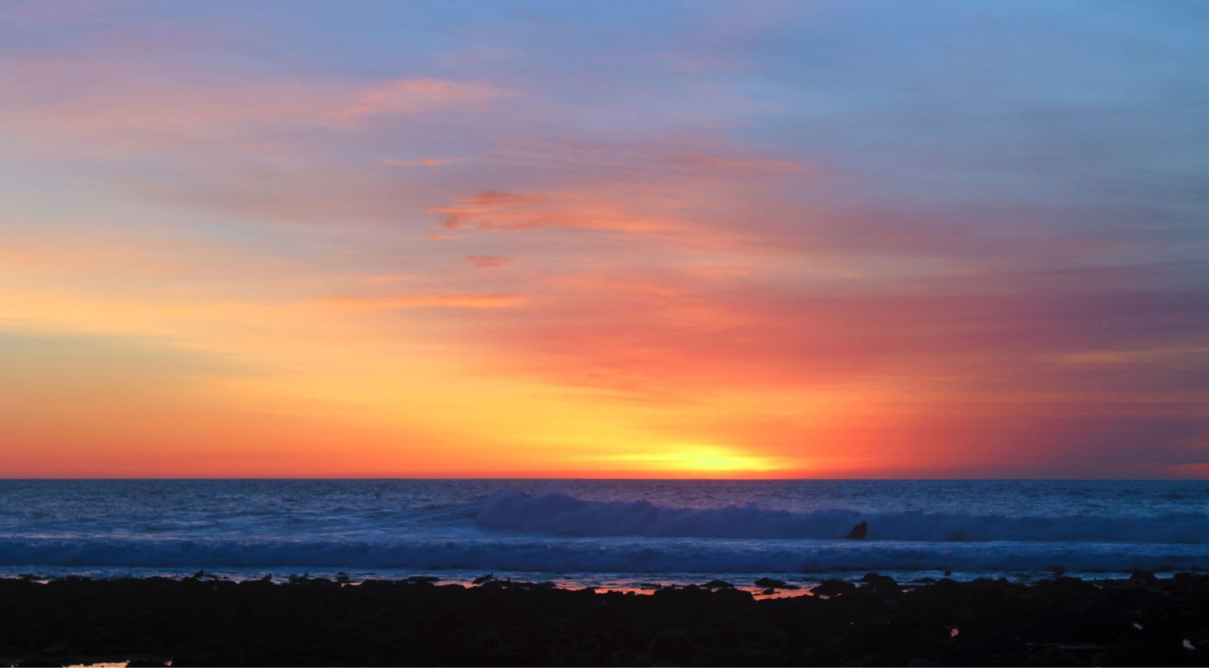 Sunset with crashing waves 