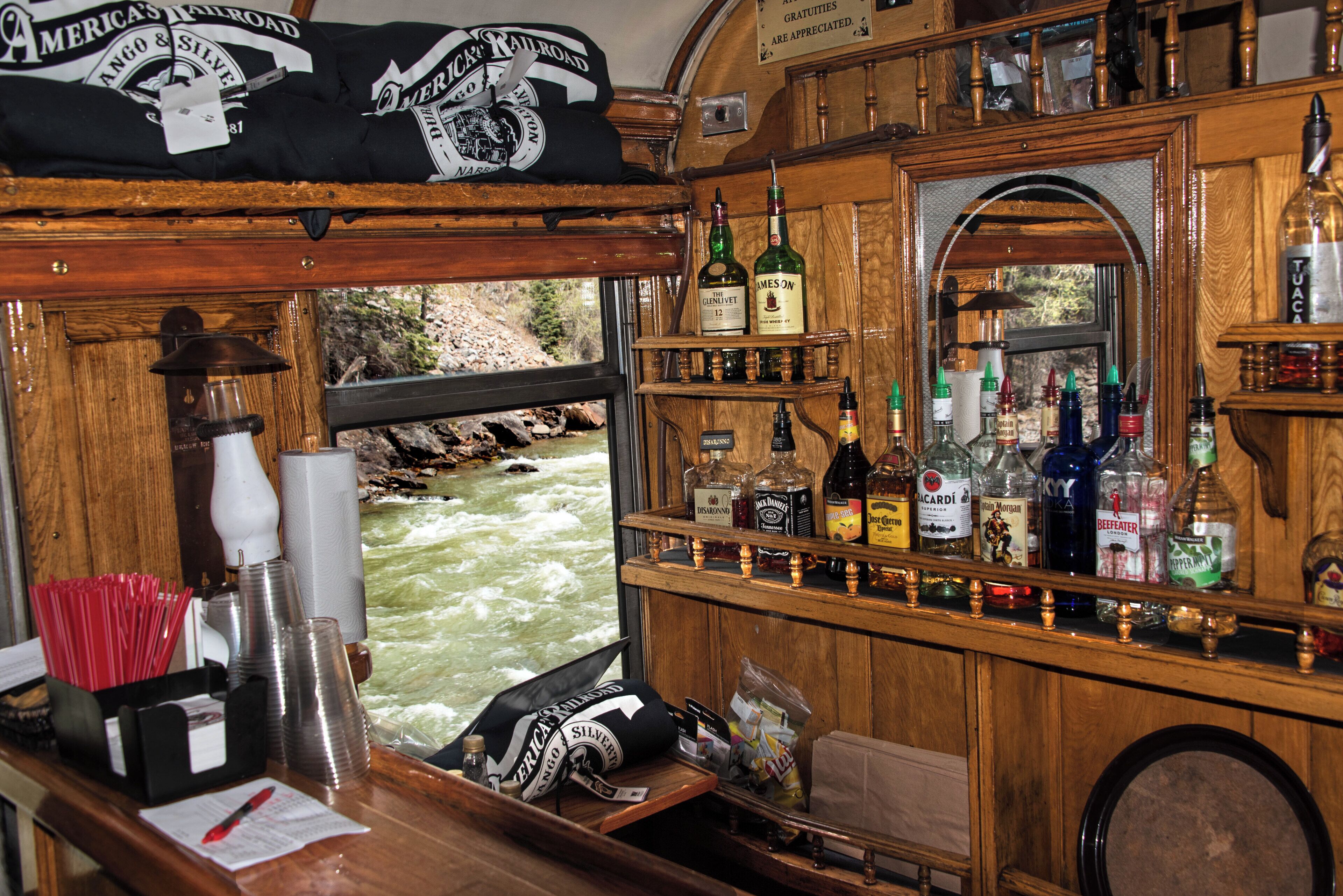 On our trip on the Durango & Silverton train, we managed to get the last two seats in the first class dining car.  I was impressed with the intricate woodwork of the 1880's vintage coach, particularly the bar, with a view of the river out the window.
#railroad
#train
#historic_rail_journeys