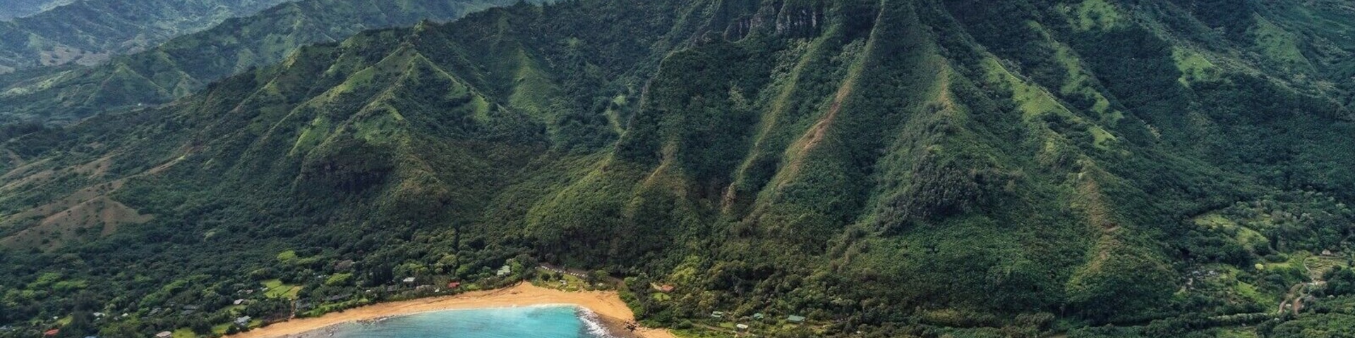 While visiting the island of Kaua'i, Hawaii, I went on my first helicopter ride, circling the island to get a view of the dramatic coastline that you can't fully appreciate from the ground. This was taken while flying past the community of Ha'ena on the north coast.