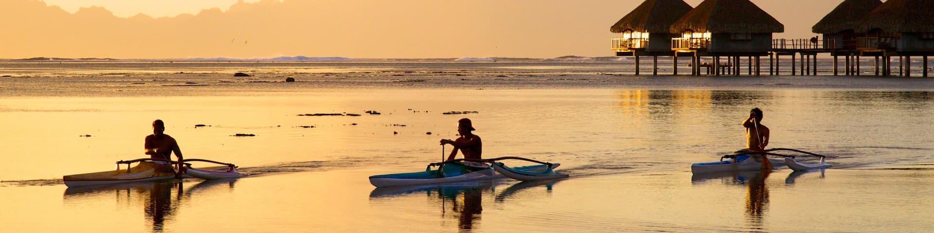Tahiti featuring kayaking or canoeing, general coastal views and a sunset