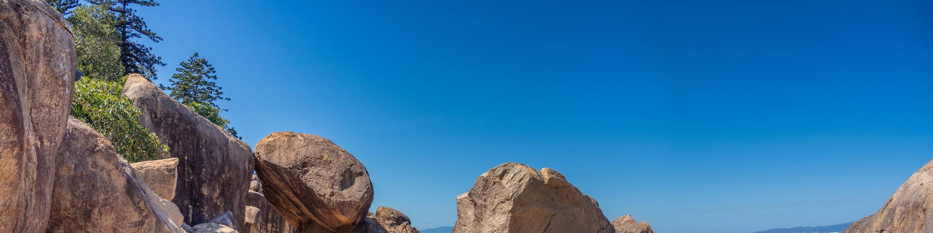 Named after the Wulgarukaba's Dreamstime Rainbow Serpent, Gabul Way, a foot path along the rocky shores of Magnetic Island (Yunbenun), offering fanstastic view of Cleveland Bay, Queensland, Australia.