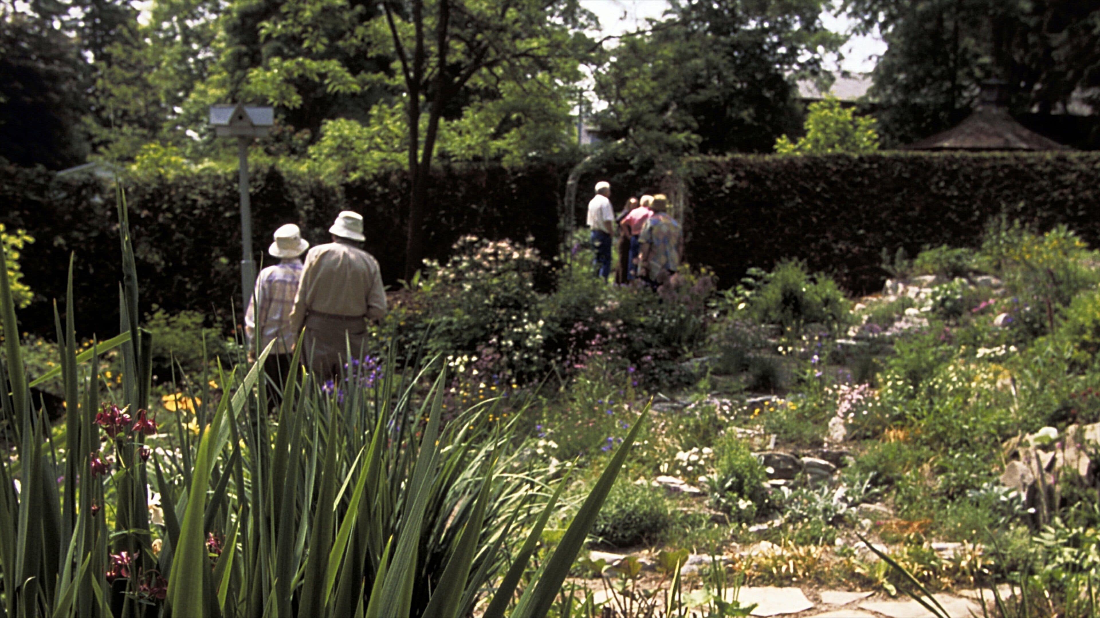 Unionville showing flowers and a garden as well as a small group of people