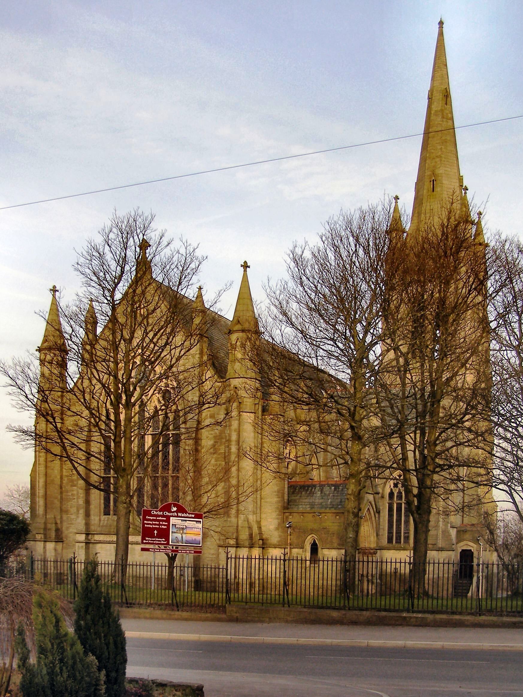 A historic church with a tall spire and multiple pointed towers.