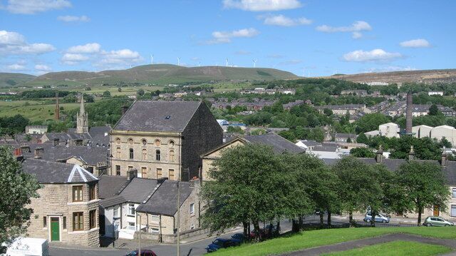 Ramsbottom and Scout Moor Wind Farm. The house on the left in the foreground is 354554 The skyline in the distance changed dramatically in 20008 857845 with the building of the 26 turbines on Scout Moor Wind Farm https://www.geograph.org.uk/gallery/scoutmoor_wind_farm_construction_6568 For more information about Ramsbottom click http://www.ramsbottom.net/index.htm