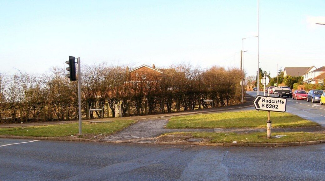 Starling Road. Starling Road at its junction with Cockey moor Road, Lowercroft Road and Ainsworth Road. The old guidepost 1701989 can be seen in front of the hedge.