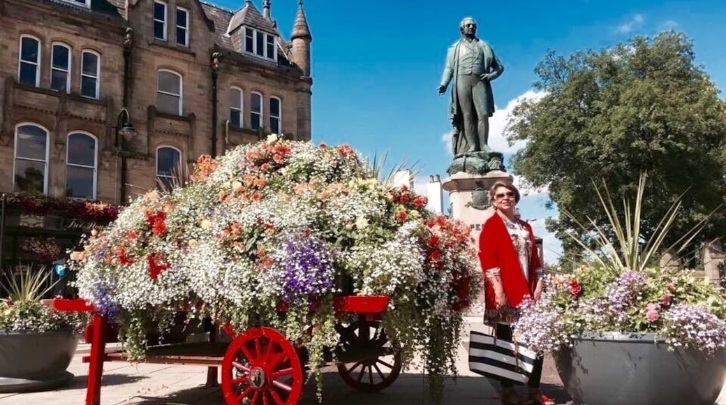 This beautiful flowers arrangement in front of the memorial and the ParishChurch of St Mary The Virgin , market place Bury Greater Manchester