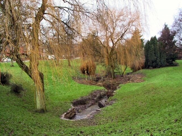 Weeping Willows at Ainsworth. This brook meanders from north to south, disappearing underground again at this point, to re-appear lower down the B6292 towards Radcliffe.