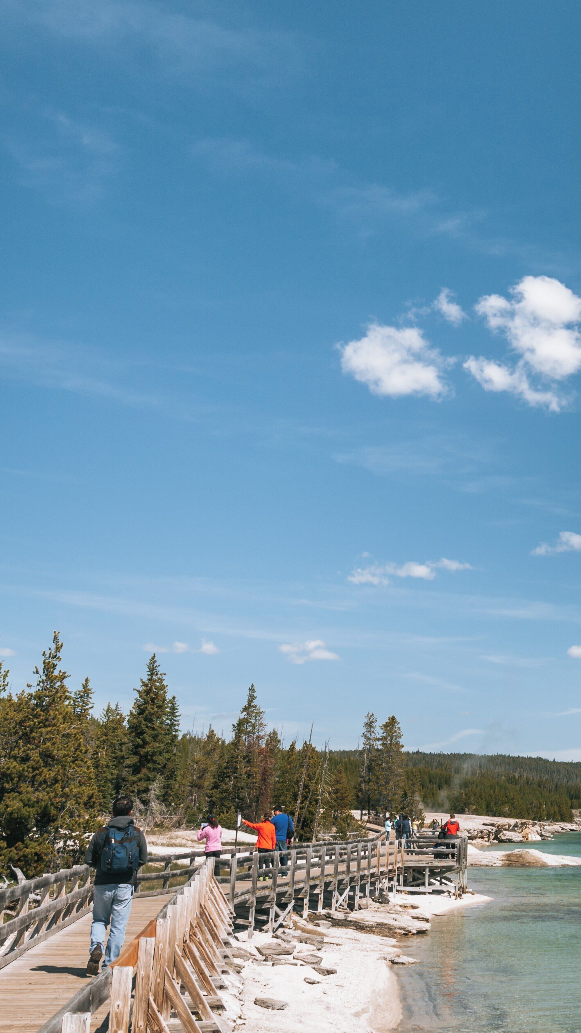 Exploring the Boardwalk at West Thumb Geyser Basin in Yellowstone National Park, Wyoming on a Clear Day