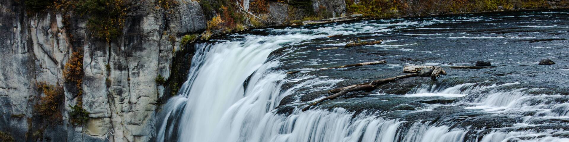 A waterfall cascading over a rocky cliff.
