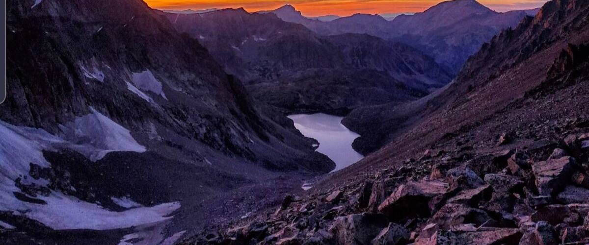 Adventure to me is getting to experience the incredible places that not many get to see and the journey it takes to get there. The things you learn along the way, the people you meet and the feeling of accomplishment when you reach your goal. A brutal climb at elevation, in rugged terrain, hot sun, wind gusts, rain, snow, curious bears, and pushing through the pain are all worth in the end when you see that view. These experiences make you truly grateful for the small things in life we take for granted every day such as a bed, running water, a toilet, and good quality toilet paper. My time spent in the mountains has taught me many things. To get comfortable being uncomfortable, never use bear spray down wind from a bear, be bold start cold (from a friend) and dont eat dehydrated beef stroganoff to name just a few. Each adventure teaches something new. This picture was taken 8:23pm descending from the summit of Granite Peak, the highest peak in Montana. We would have probably never seen this view if we had stuck to the original plan. We ended up hiking over 20 hours straight and encountered a bear in the middle of the night on the route back to camp. Not ideal! However, I learned to stick to the original plan and never underestimate how bad your lungs will burn and how slow you walk when you go from 1100 ft. to over 12,000 ft. in less than 48 hours, but another adventure is in the books. Climbing mountains can be absolutely torture on your mind and body and at the same time can be so rewarding. I find in the end I always want to go back for more.