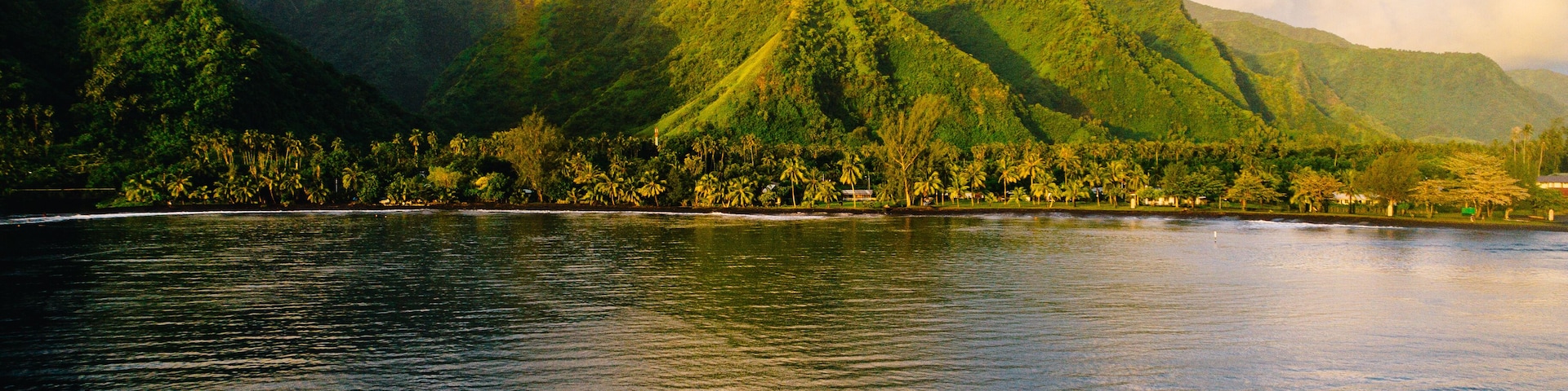 Boat heading towards island, Teahupoo, Tahiti