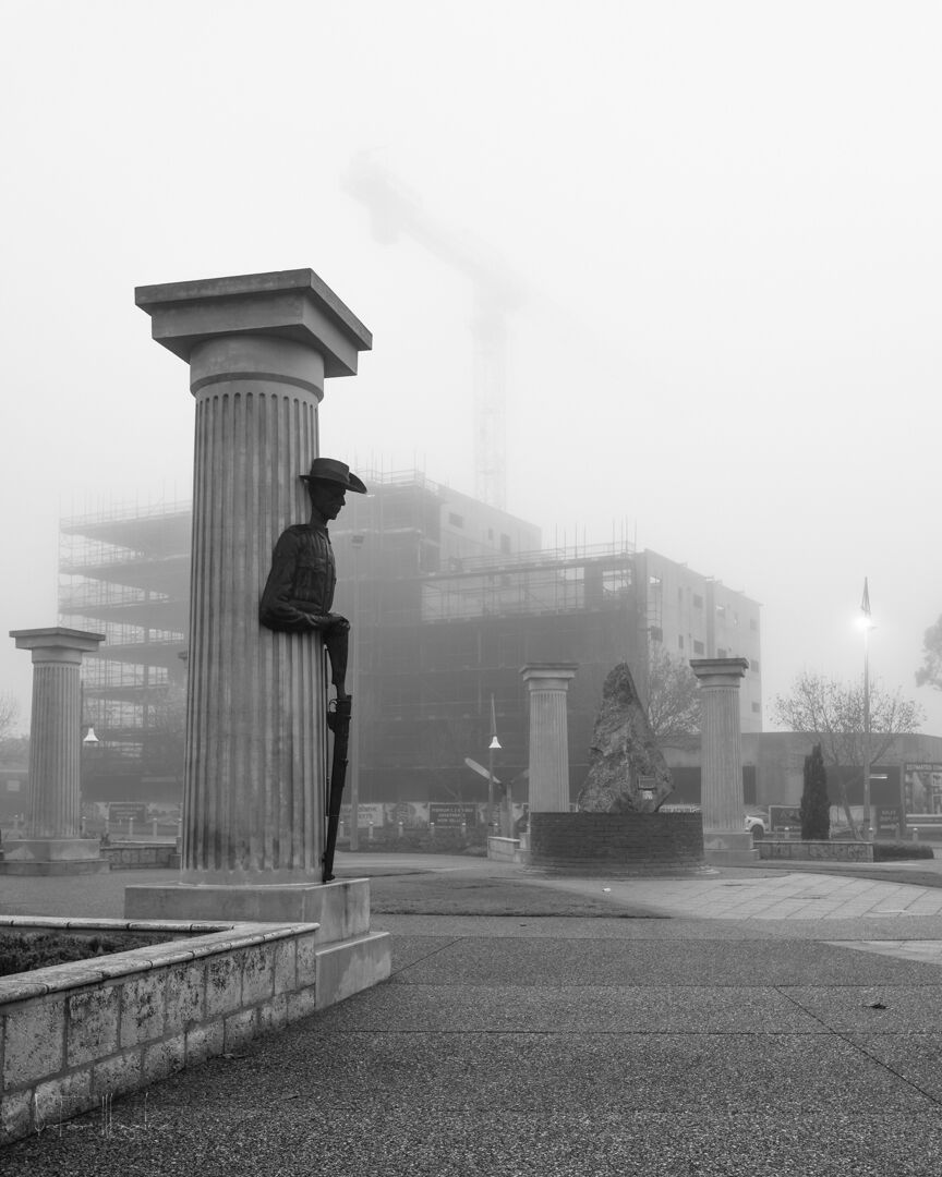 Caught in the fog in early July, the next highrise emerges to overlook the memorial.
