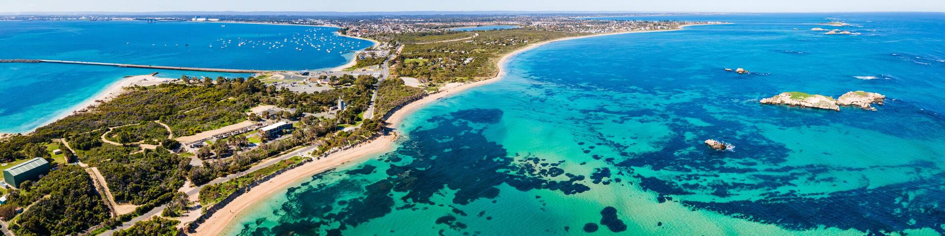 Aerial view of Point Peron and Shoalwater Bay with rocky limestone formations and seagrass.