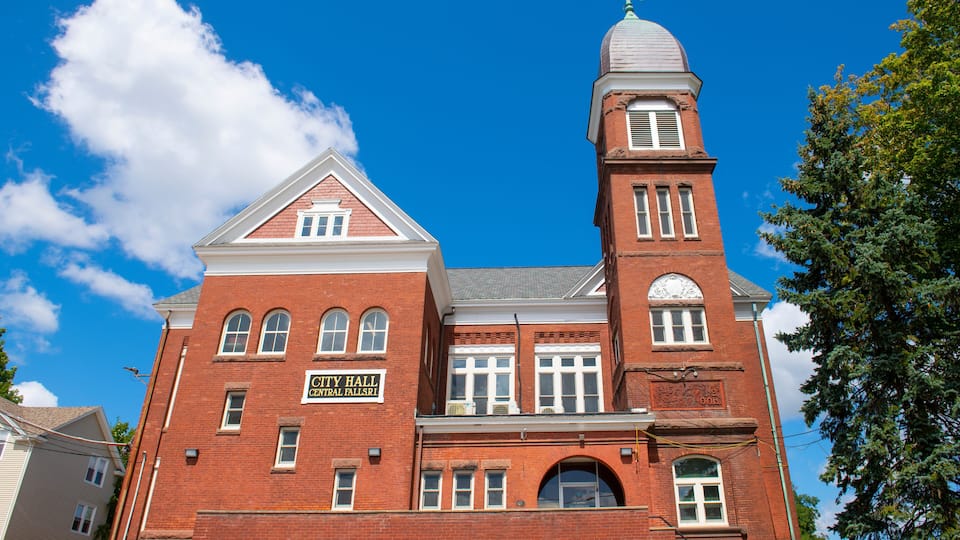 A red brick building with a clock tower and a sign reading "City Hall Central Falls."