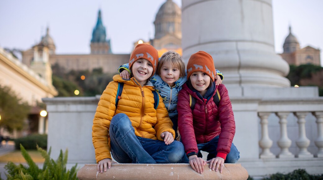Children, playing in front of the Catalona national museum MNAC on Montjuic mountain in Barcelona