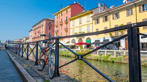 Bike near railing of Naviglio Grande grand canal, Milan, Italy