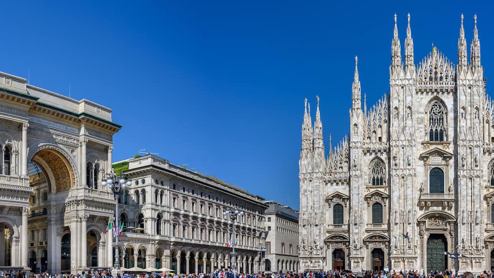 A grand cathedral with intricate Gothic architecture and a classical building with ornate details.