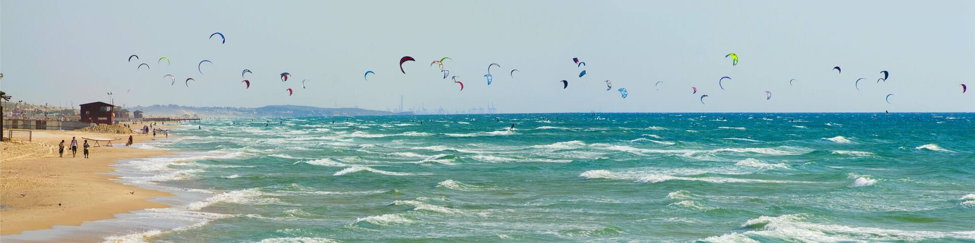 Lots of kites above sea, Bat-Yam beach, Israel