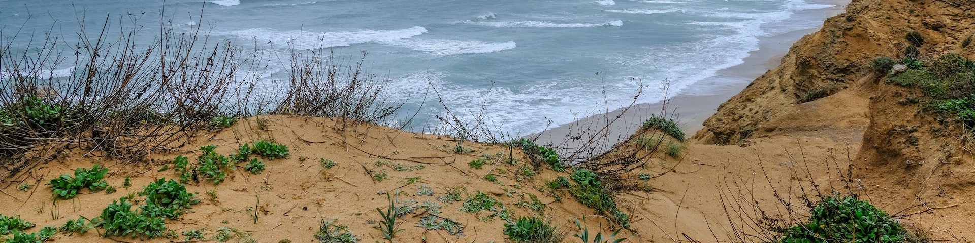 Arsuf cliffs, a kurkar sandstone cliff reserve towering high above the Mediterranean sea coastline between Herzliya and Netanya towns, Israel.