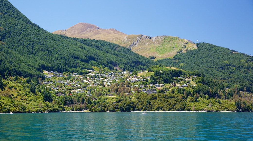 Sunshine Bay featuring forests, mountains and a small town or village