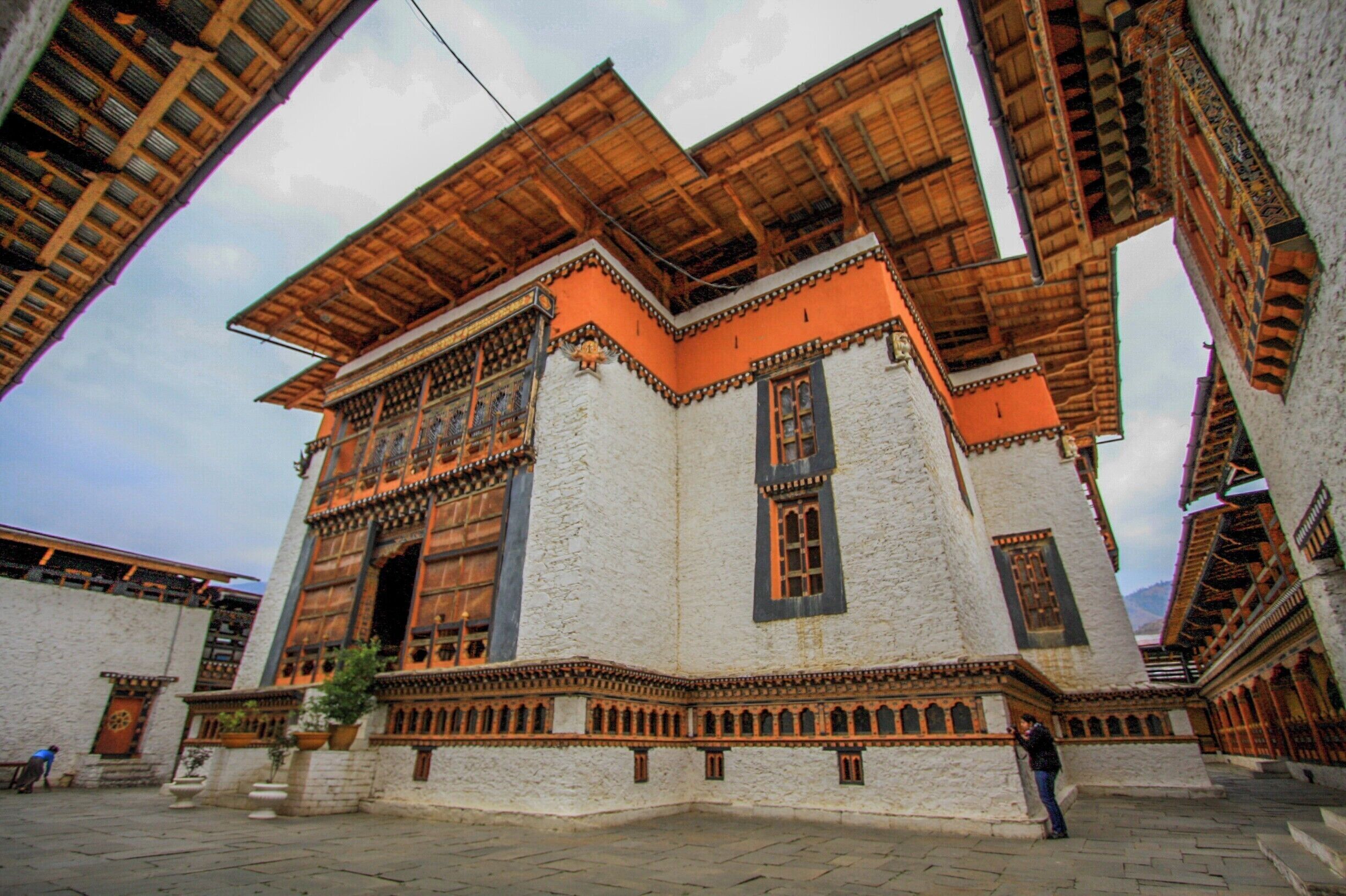 #simtokhadzong #dzong #thimpu #bhutan 
#stunningstructures 
Bhutan itself has sparse travelers. But to find a beautiful monastery devoid of any mad rush or travelers is divine. Tucked away in a corner of Thimpu is this quiet and unassuming Simtokha Dzong. Beautiful carvings, hand painted flags, intricate mani prayer wheels, an old courtyard from the 16th century. Its easy to say this was my favorite place in Bhutan. You can spend hours here just reading a book or soaking in the calm.