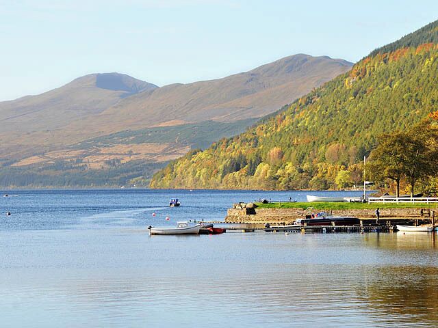 Jetty at Kenmore on Loch Tay On the right is wooded Drummond Hill. In the distance on the left is Ben Lawers.