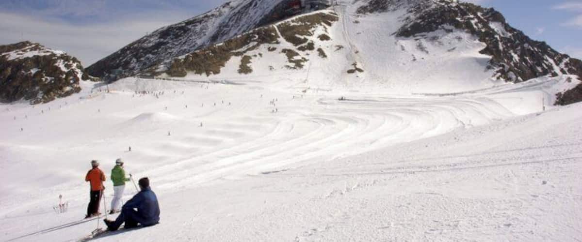 Skiers having a break and admiring the view on the top of Kitzsteinhorn.
#Snow