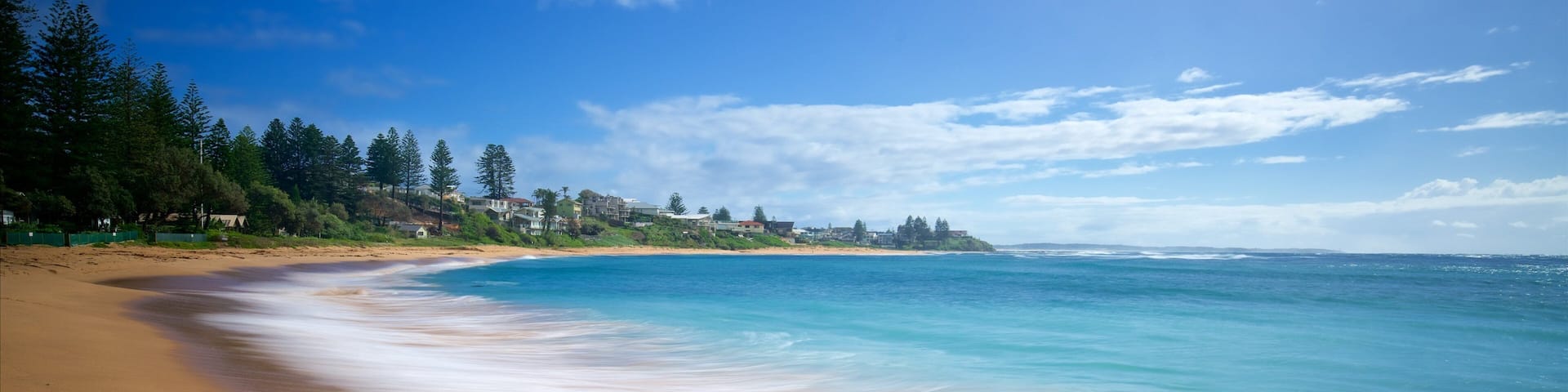 The Entrance featuring a bay or harbour and a beach