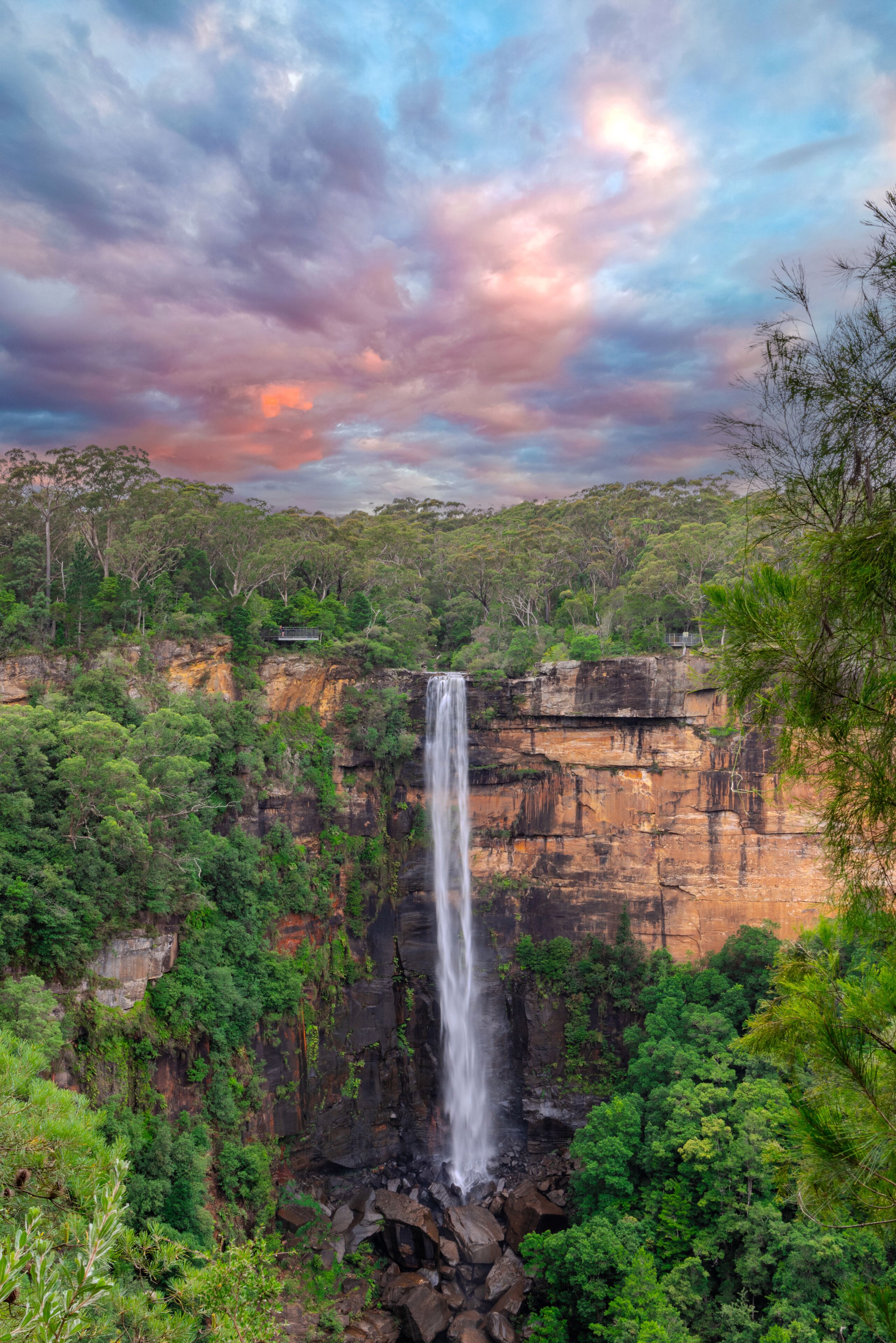 Beautiful flowing River in Fitzroy water Falls in Bowral NSW Australia beautiful colourful cloudy skies lovely waterfalls