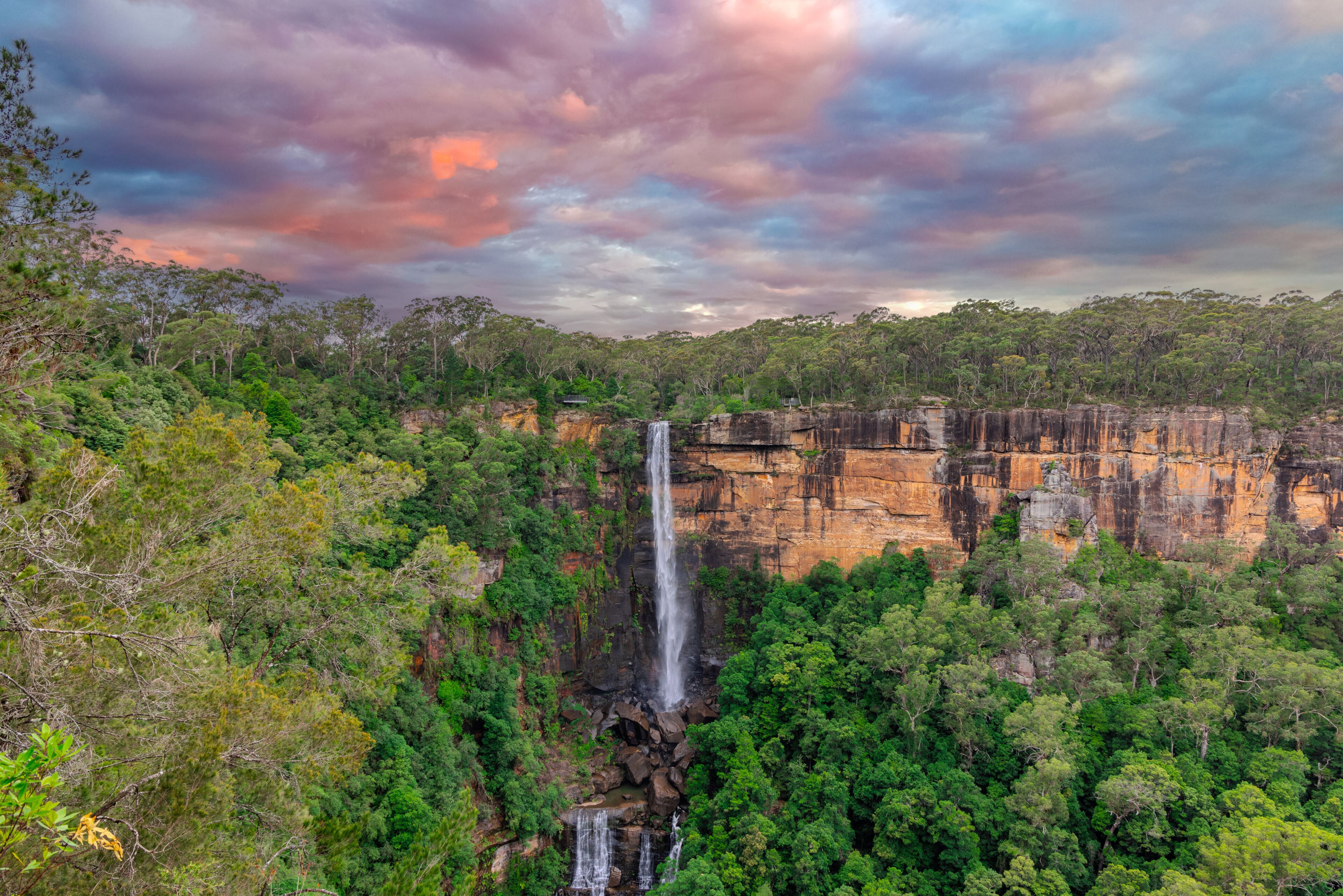 Beautiful flowing River in Fitzroy water Falls in Bowral NSW Australia beautiful colourful cloudy skies lovely waterfalls