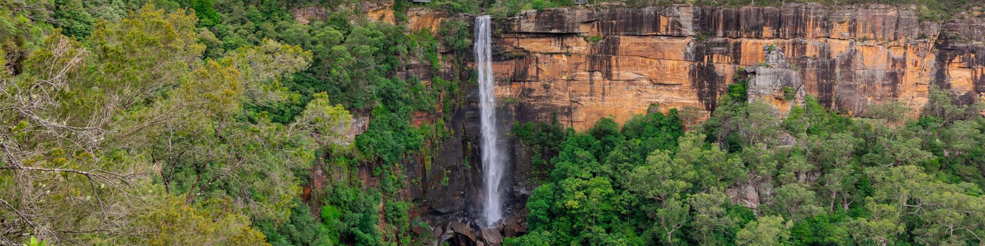Beautiful flowing River in Fitzroy water Falls in Bowral NSW Australia beautiful colourful cloudy skies lovely waterfalls