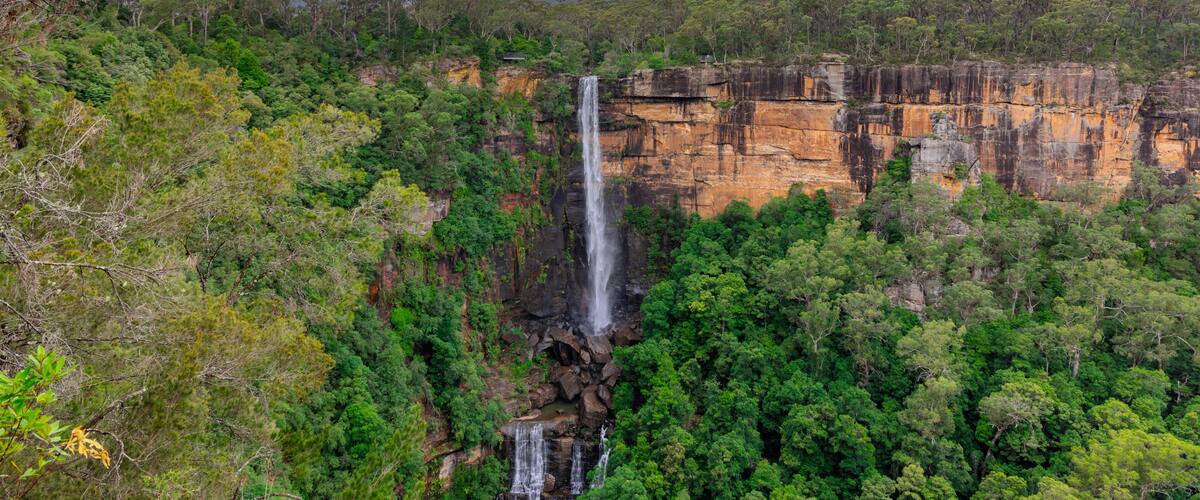 Beautiful flowing River in Fitzroy water Falls in Bowral NSW Australia beautiful colourful cloudy skies lovely waterfalls