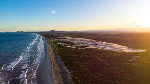Aerial (drone) view spectacular coastline and Pacific ocean at sunset in Hat Head National Park, NSW, Australia