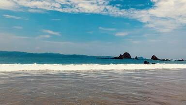 Hereâs a beach that still manages to keep out big hotel chains and makes the trip one to fully enjoy the sea. #waves #pacific #sea #blue #beach #clearsky #mexico #mexicanbeach