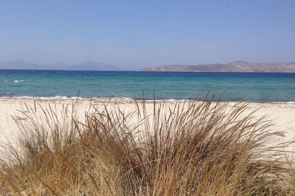 Sand , crystal blue water , sand dunes and salt lake nearby the beach . Tigaki, kos , Greece