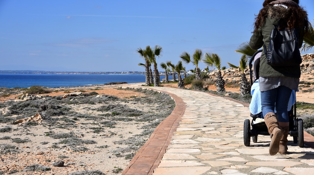 woman with stoller with baby going for a walk in ayia napa
