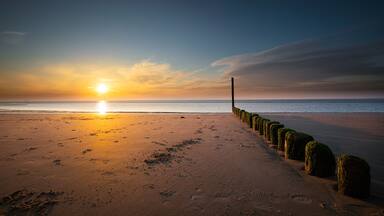 Beautiful sunset at the westerschelde sea at the dutch coast in zeeland, Nieuwvliet.