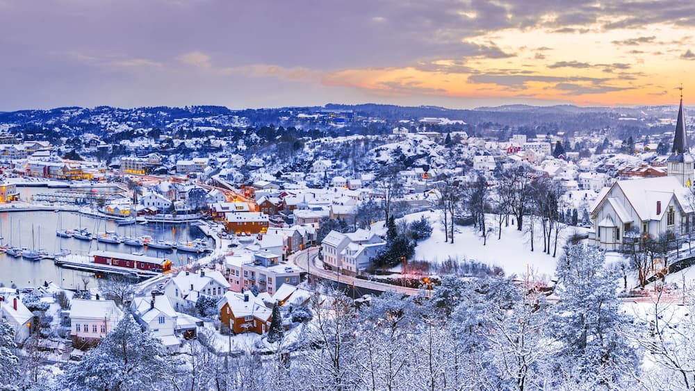 Picturesque aerial view of town with buildings in sunset